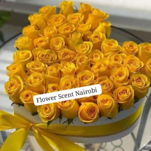 Yellow roses in a heart box
