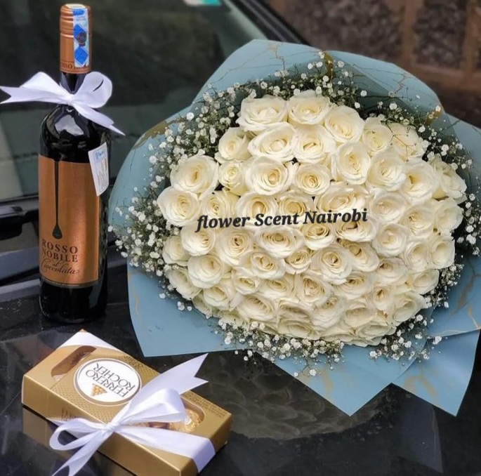 WHITE ROSES BOUQUET,CHOCOLATE AND RED WINE GIFT DELIVERY IN NAIROBI